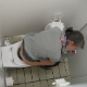 A person risks everything to video record an unsuspecting woman taking a shit and wiping while sitting on a toilet in an adjoining bathroom stall of a public restroom. Excellent audio with plopping sounds! About 3.5 minutes.